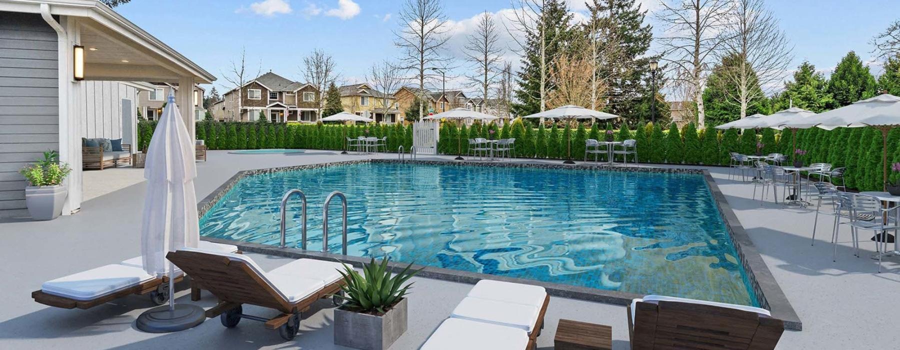 a swimming pool with lounge chairs and umbrellas